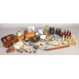 A large assortment of collectables. To include chess set, cigarette dispenser, vintage postcards,