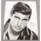 George Hamilton, an autographed monochrome photograph. (25.5cm x 20. 5cm) No provenance