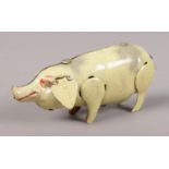 A small clockwork tinplate pig. No key.