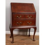 A ladies walnut writing bureau, fitted interior raised on cabriole supports. (100cm height 61.5cm