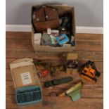 A box of vintage toys. Including Pelham puppet kit, diecast vehicles, Tonka, lead figures, etc.