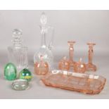 A quantity of glass ware. Two cut crystal glass decanters, glass paperweights, dressing table set
