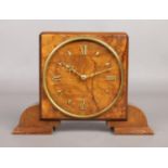 An art deco walnut cased mantle clock, with gilt dial markers and Rotherhams English Movement.