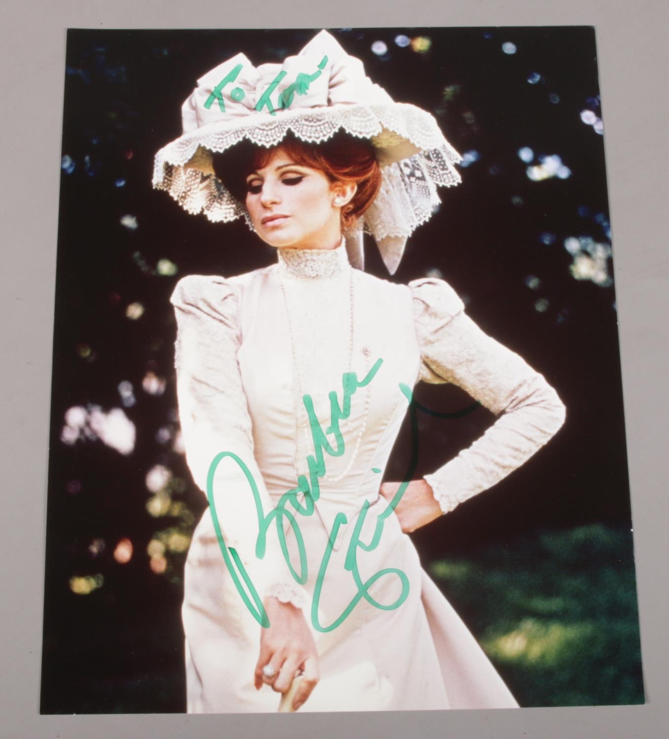 Barbara Streisand, an autographed coloured photograph. 25.5cm x 20.5cm No provenance