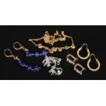 A collection of 9ct gold jewellery. Includes three pairs of earrings and two necklaces.