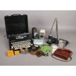 A box of miscellaneous. To include a Silver reed 'Silverette' portable typewriter, a Weston Master
