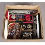 A box of costume jewellery. Including terrier brooches & studs, marcasite, etc.