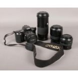 A Minolta Dynax 303SI camera and three Minolta lenses. Lenses all in cases.