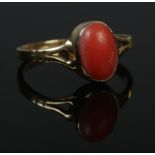 An 18ct gold coral ring. Size M. 2.03g. Tested.