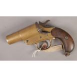 A military WWI Webley & Scott flare gun. Stamped 14 baring the broad arrow mark. Part of wooden grip