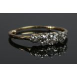 A yellow metal five stone diamond ring. Size O. 2.12g. Shank with sizing beads.