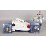 A Manta Force spaceship, along with a small collection of figures including two Del Prado