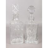 Two cut glass decanters with stoppers. Tallest: H:29cm. No chips or cracks.