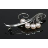 A silver Mikimoto cultured pearl brooch. With monogram mark.