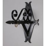 A large iron bracket, with scrolled decoration, purportedly designed to house an airfield '
