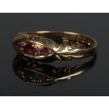 An 18ct gold diamond and pink stone ring in boat shaped setting. Size P 1/2. 1.67g.