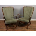 A pair of mid century Ercol easy arm chairs.