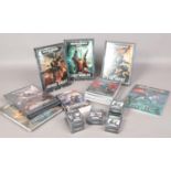 A quantity of Warhammer books & data cards. To include datacards Craftworlds, Tyranids,