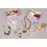 A quantity of costume jewellery. Brooches, necklaces, beads etc.