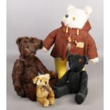 A collection of soft toys. Includes 1970s Paddington, bear with growler and two others.