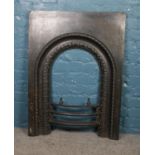 A Victorian cast iron fireplace. (96cm height 71cm width)