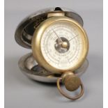 A Dalvey pocket barometer. H:8cm W:8cm.