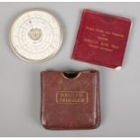 A leather cased Halden Calculex circular slide rule, complete with original booklet. Damage to outer