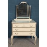 A French style white painted dressing table.