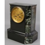 An eight day slate mantel clock with verdigris marble decoration and gilt dial. Chiming on a bell.