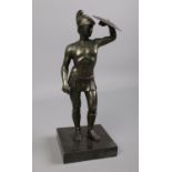 A cast metal figure of a Roman warrior on plinth. H: 26cm. Missing sword. No signature.