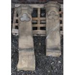 A pair of large carved limestone pillars with trefoil motif. Largest 145cm.