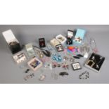 An extremely large assortment of costume jewellery, including earrings, brooches, necklaces and