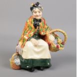 A Royal Doulton 'Old Lavender Seller' figurine. HN1492