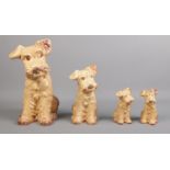 A collection of Sylvac dog figurines. All stamped to base. No's 1380, 1379, 1378 x 2. Tallest 28cm.