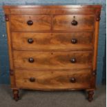 A large Victorian carved mahogany bow front chest of two over three drawers. (128cm x 113cm x 56cm)