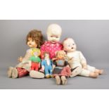 A selection of vintage dolls. To include a British Made large doll, a Pedigree Doll and soft body