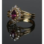 An 18ct gold ruby and diamond cluster ring. Size L. 3.83g.