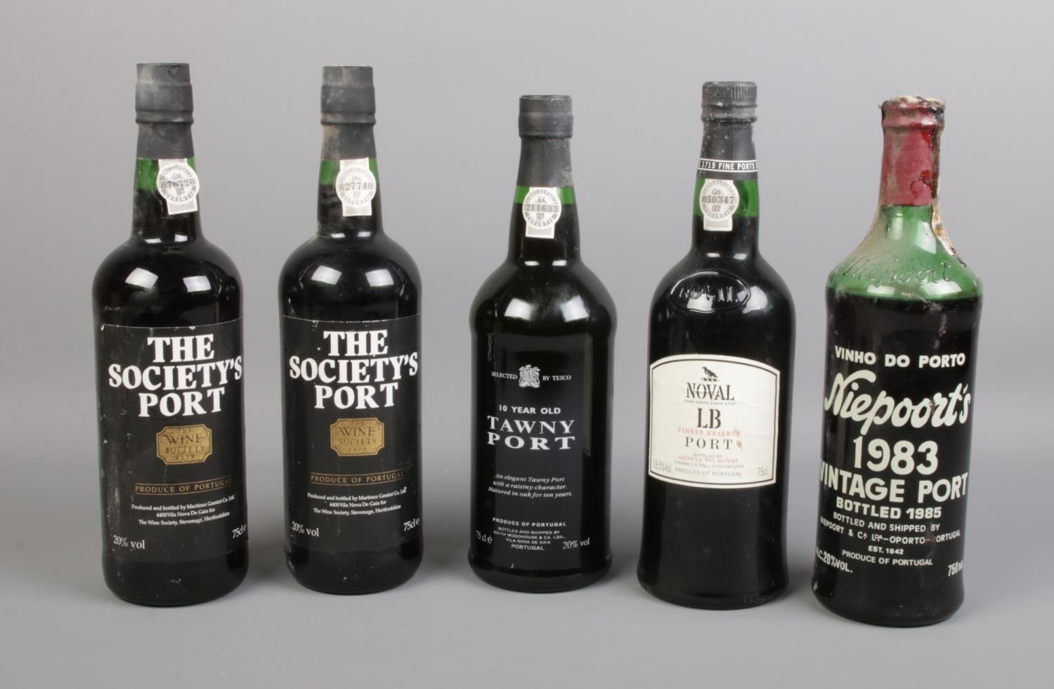 Five bottles of alcohol. To include two bottles of The Society's Port, Noval LB Port, and 10 year