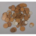 A selection of British pre decimal coins. To include one pennies, half pennies, six pence and one