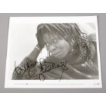 Whoopi Goldberg, autographed monochrome photograph. (25.5cm x 20cm) No provenance