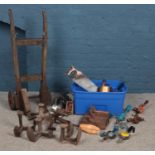 A large assortment of tools. To include planes, manual hand drills and cast iron shoe formers etc.