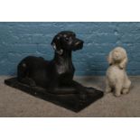 Two garden statues formed as dogs. (Tallest 50cm) Front paw loose on concrete example.