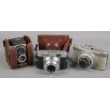 Three vintage cameras. Includes Ross Ensign Ful Vue Super, Voigtlander Vito B and one other.