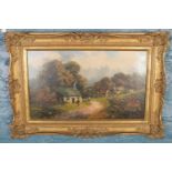 A.Herbert, gilt framed oil on canvas. Cottage scene with figures. (28cm x 49cm)