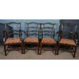 A set of 8 carved ladder back dining chairs. Including two carver examples. Some of the chairs in