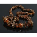 A raw amber/copal necklace. Comprising of a single row of graduated cognac coloured freeform