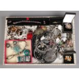 A large tray containing an assortment of costume jewellery, mostly necklaces. To also include