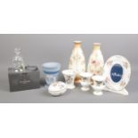 A small selection of named ceramics and crystal. To include a boxed Waterford Lismore Bell, Wedgwood
