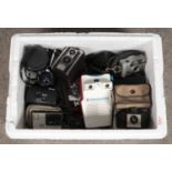 A box of assorted cameras and equipment, to include Kodak Brownie 127 camera, Vivitar 28mm lens