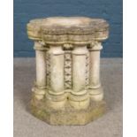 A carved limestone octagonal garden pedestal plinth, of font design, with detachable top and